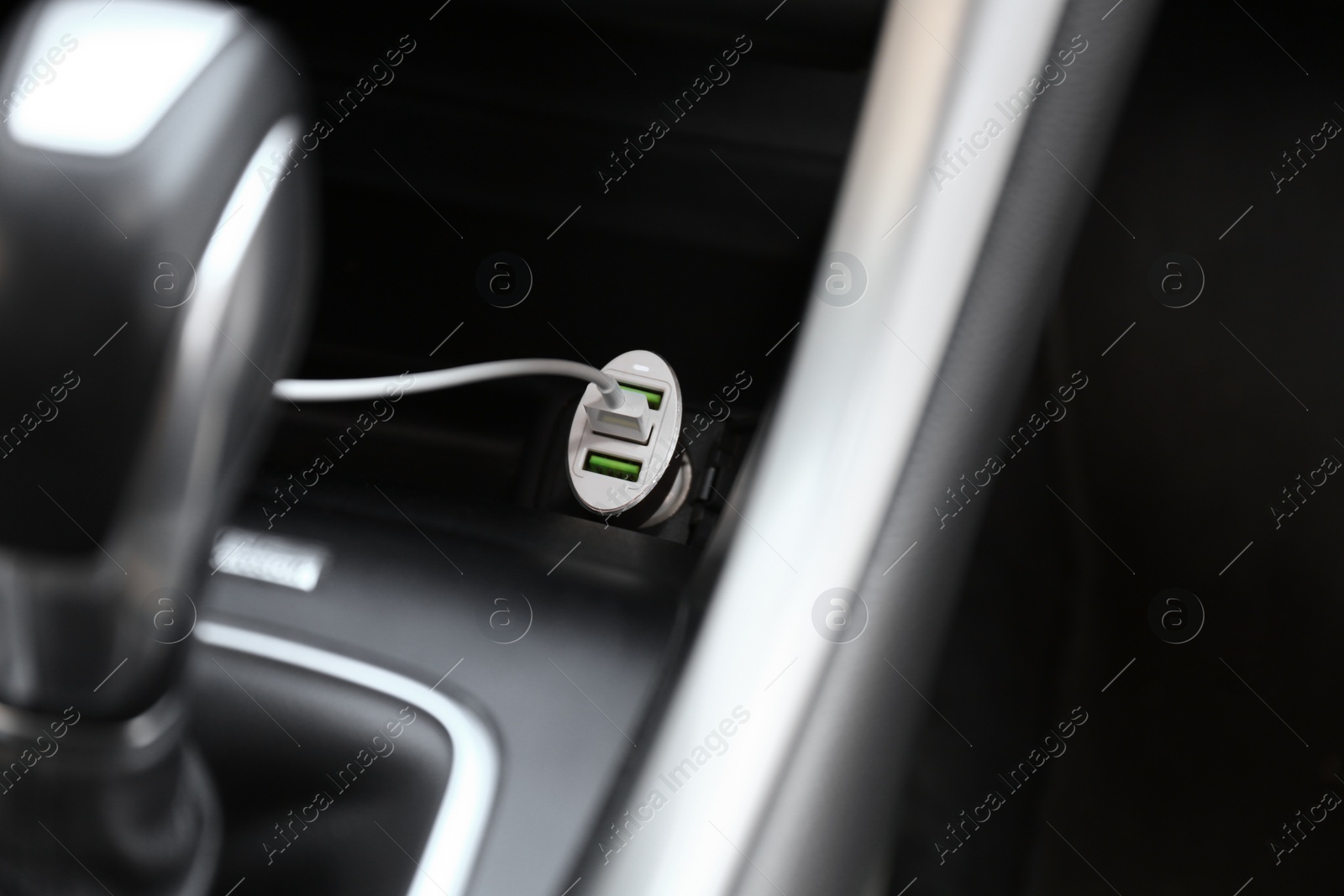 Photo of Charging cable connected to plug in car