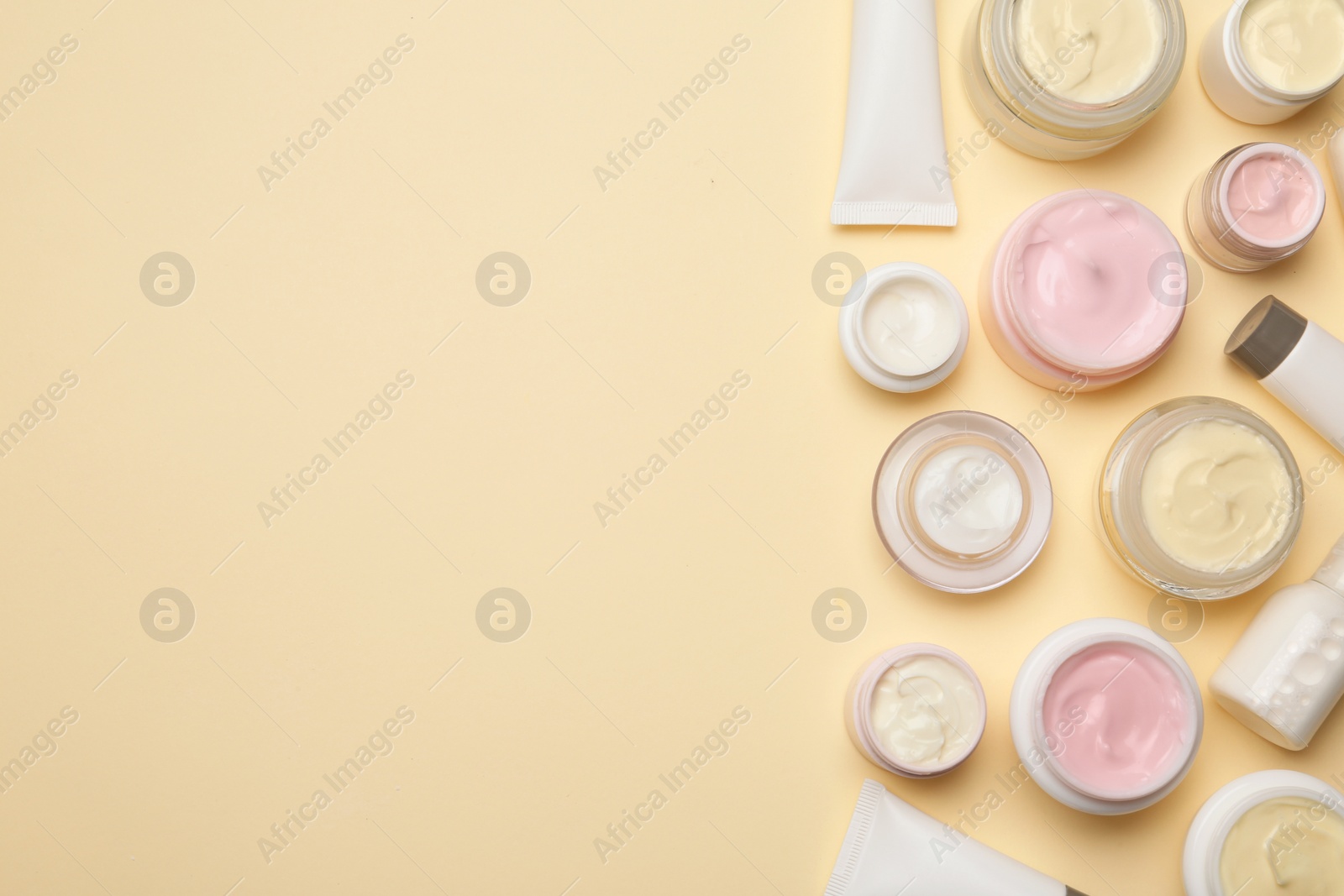 Photo of Flat lay composition with body care products and space for text on color background