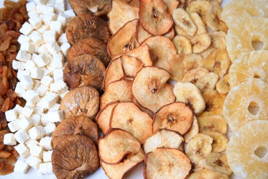 Photo of Different tasty dried fruits as background, closeup