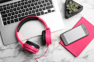 Photo of Flat lay composition with smartphone, laptop and headphones on table