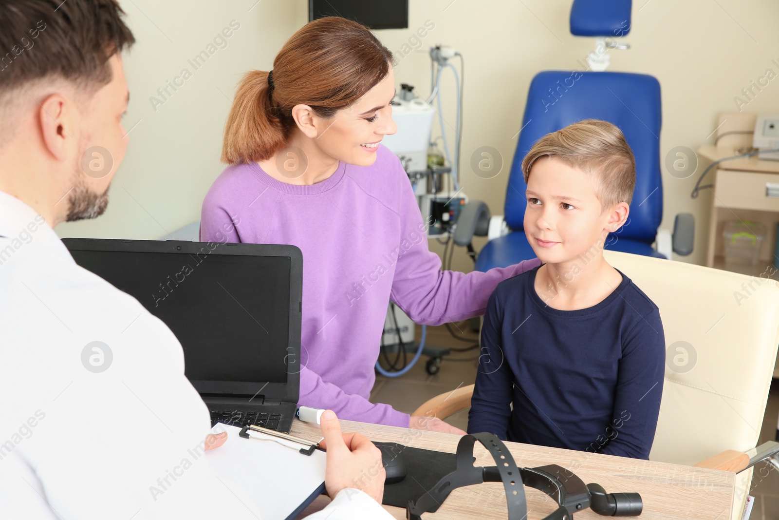 Photo of Woman with her child visiting doctor in hospital