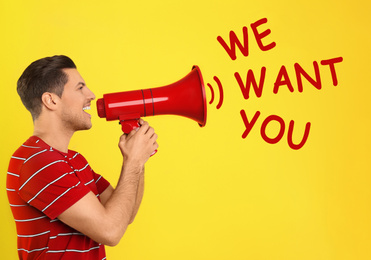 Image of Man with megaphone and phrase WE WANT YOU on yellow background. Career promotion