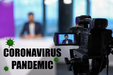 Image of Presenter working in studio. Coronavirus pandemic - latest updates