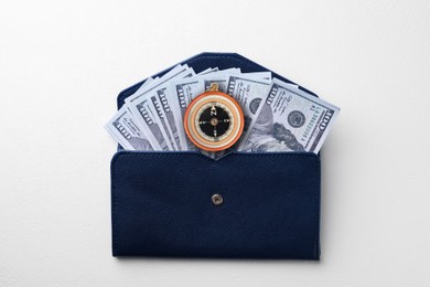 Image of Exchange rate. Wallet with money (dollar banknotes) and compass on white background, top view