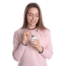 Young attractive woman with tasty yogurt on white background