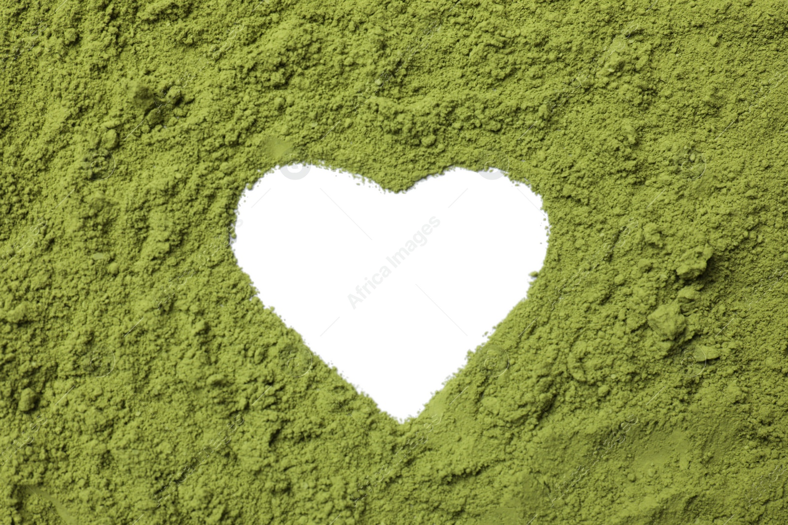 Photo of Heart-shaped frame made of green matcha powder on white background, top view