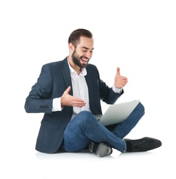 Photo of Emotional businessman in office wear with laptop celebrating victory on white background