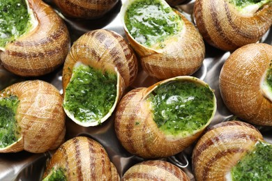 Delicious cooked snails on table, closeup view