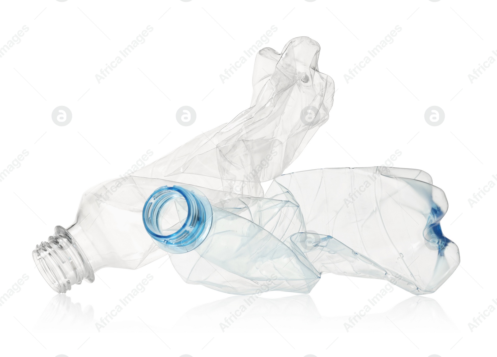 Photo of Crumpled disposable plastic bottles isolated on white