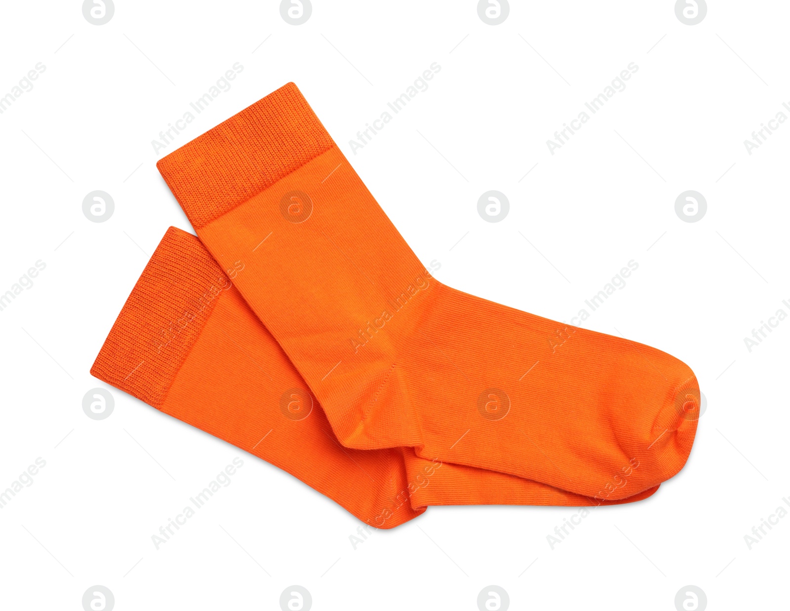 Photo of Pair of orange socks on white background, top view