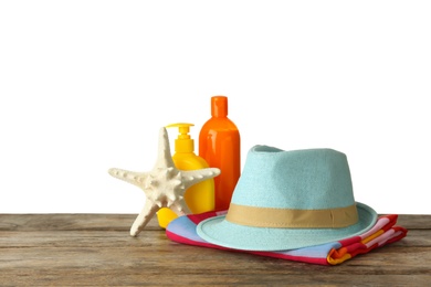 Set of beach accessories on table against white background. Space for text