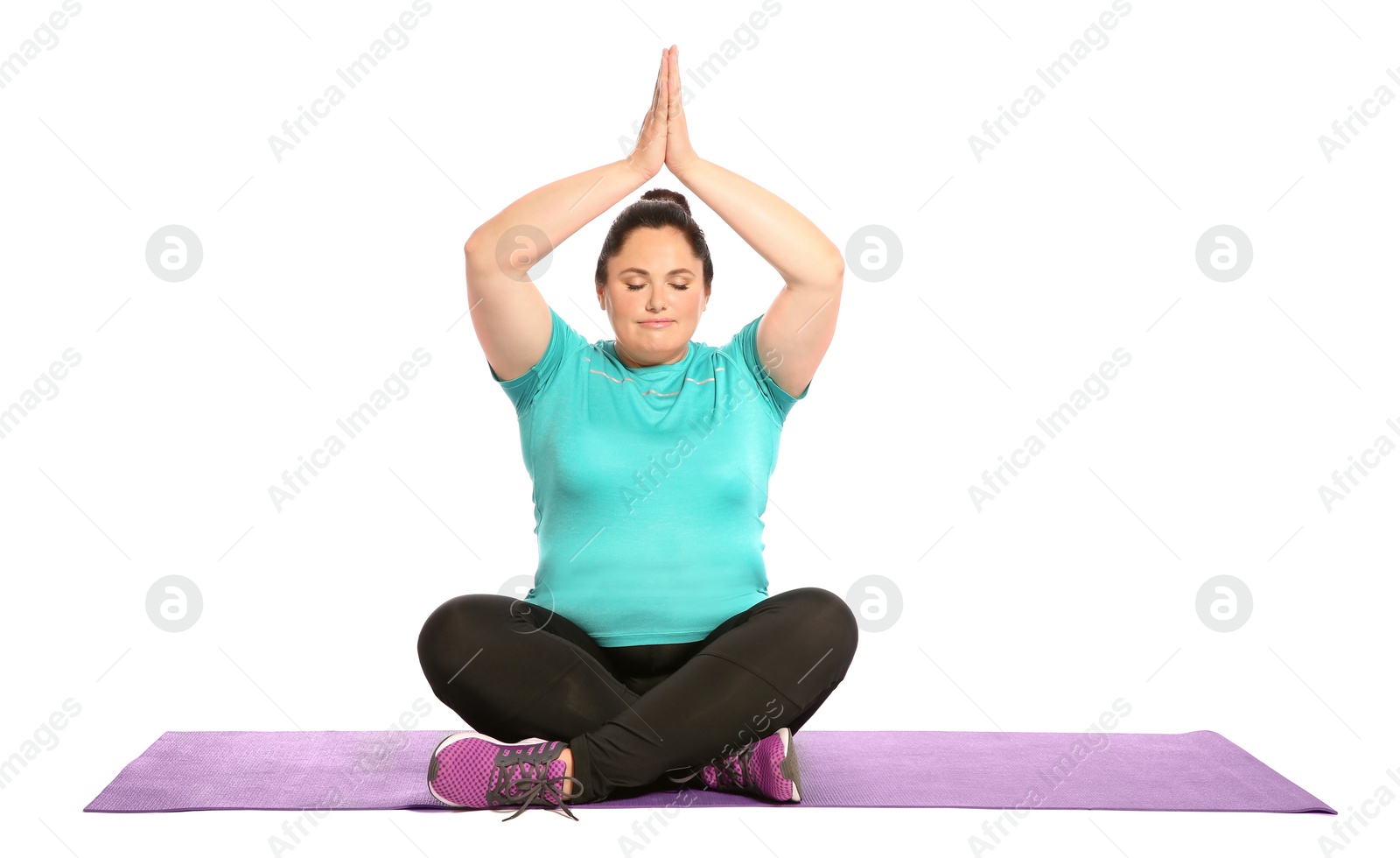 Photo of Overweight woman practicing yoga on white background