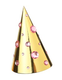 Photo of One shiny golden party hat with rhinestones isolated on white