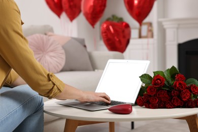 Photo of Valentine's day celebration in long distance relationship. Woman chatting with her boyfriend at home, closeup