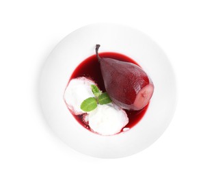 Photo of Tasty red wine poached pear with mint 'and ice cream isolated on white, top view