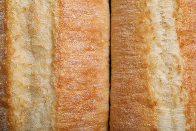 Photo of Tasty baguettes as background, top view. Fresh bread