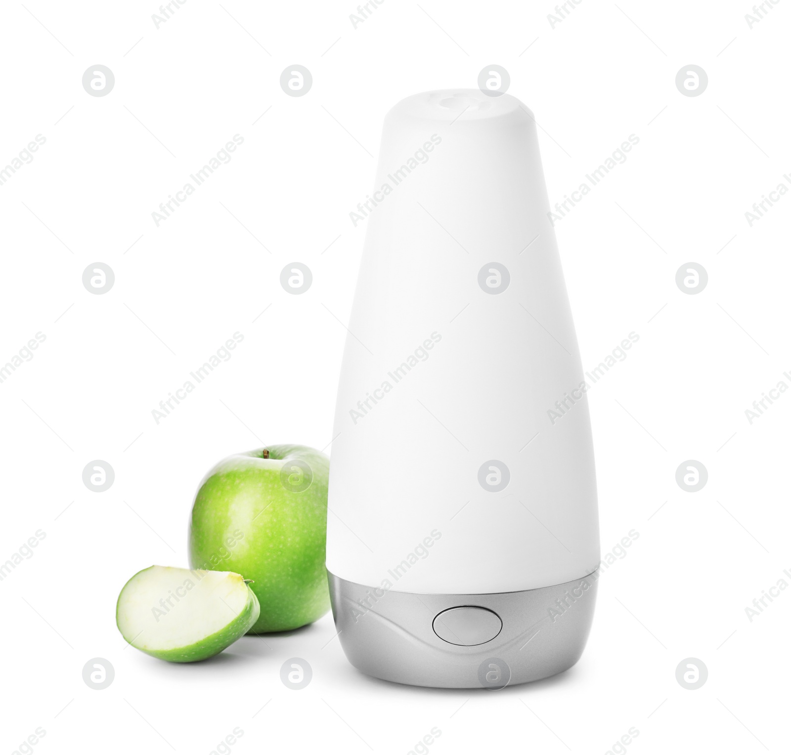 Photo of Automatic air freshener and apple on white background