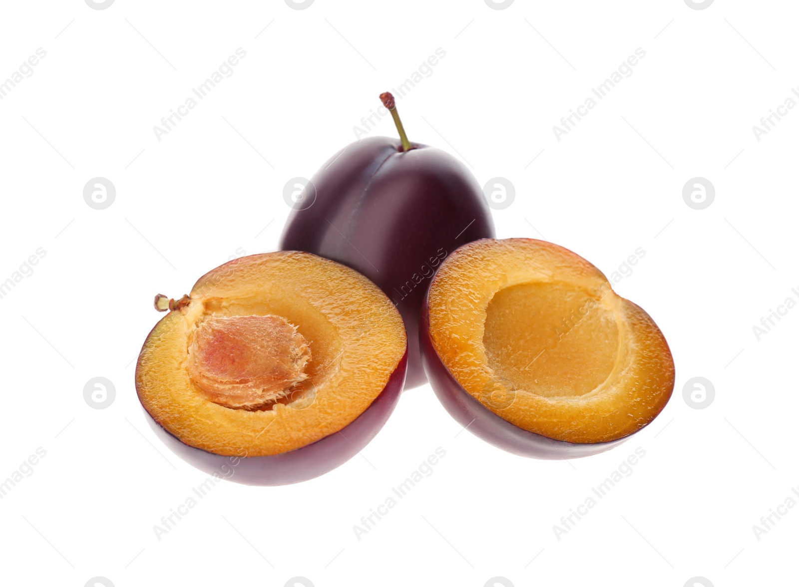 Photo of Whole and cut ripe plums isolated on white