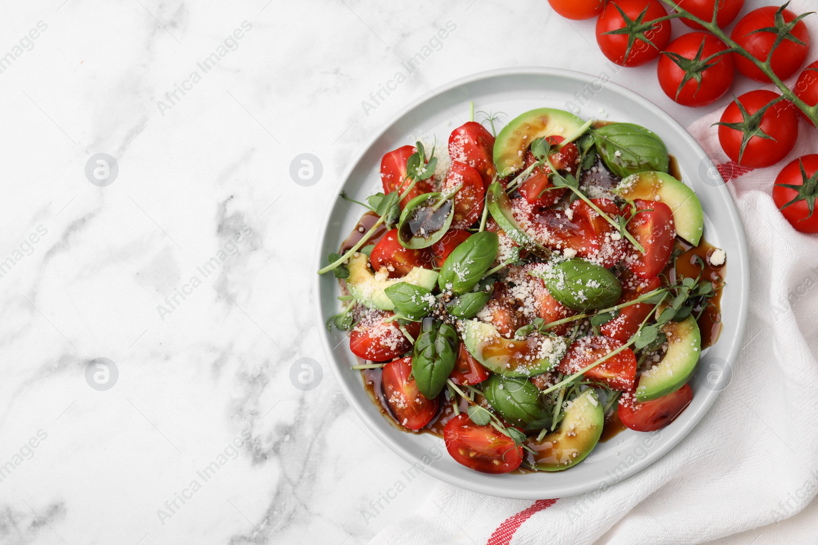 Photo of Tasty salad with balsamic vinegar on white marble table, flat lay. Space for text