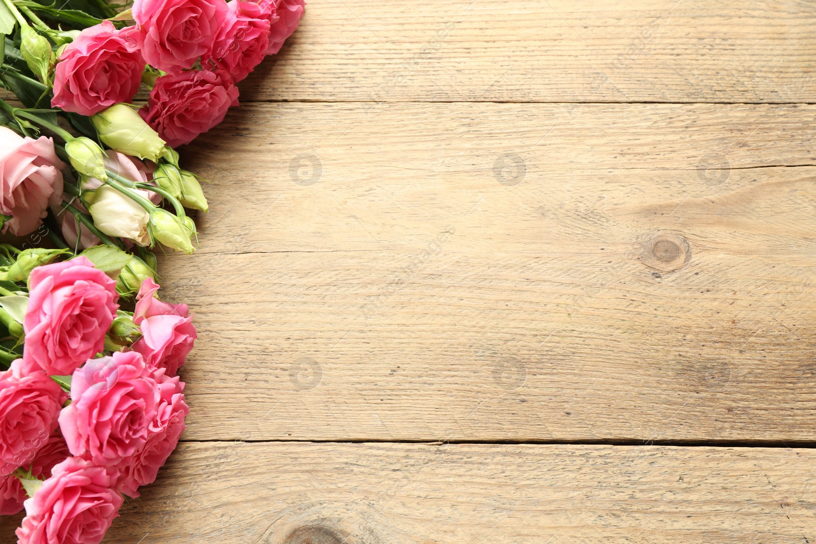 Photo of Happy Mother's Day. Beautiful flowers on wooden table, flat lay. Space for text