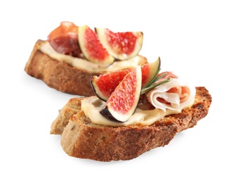 Photo of Bruschettas with cream cheese, prosciutto and figs isolated on white