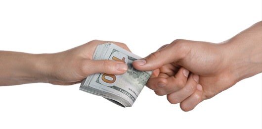 Photo of Money exchange. Man giving dollar banknotes to woman on white background, closeup