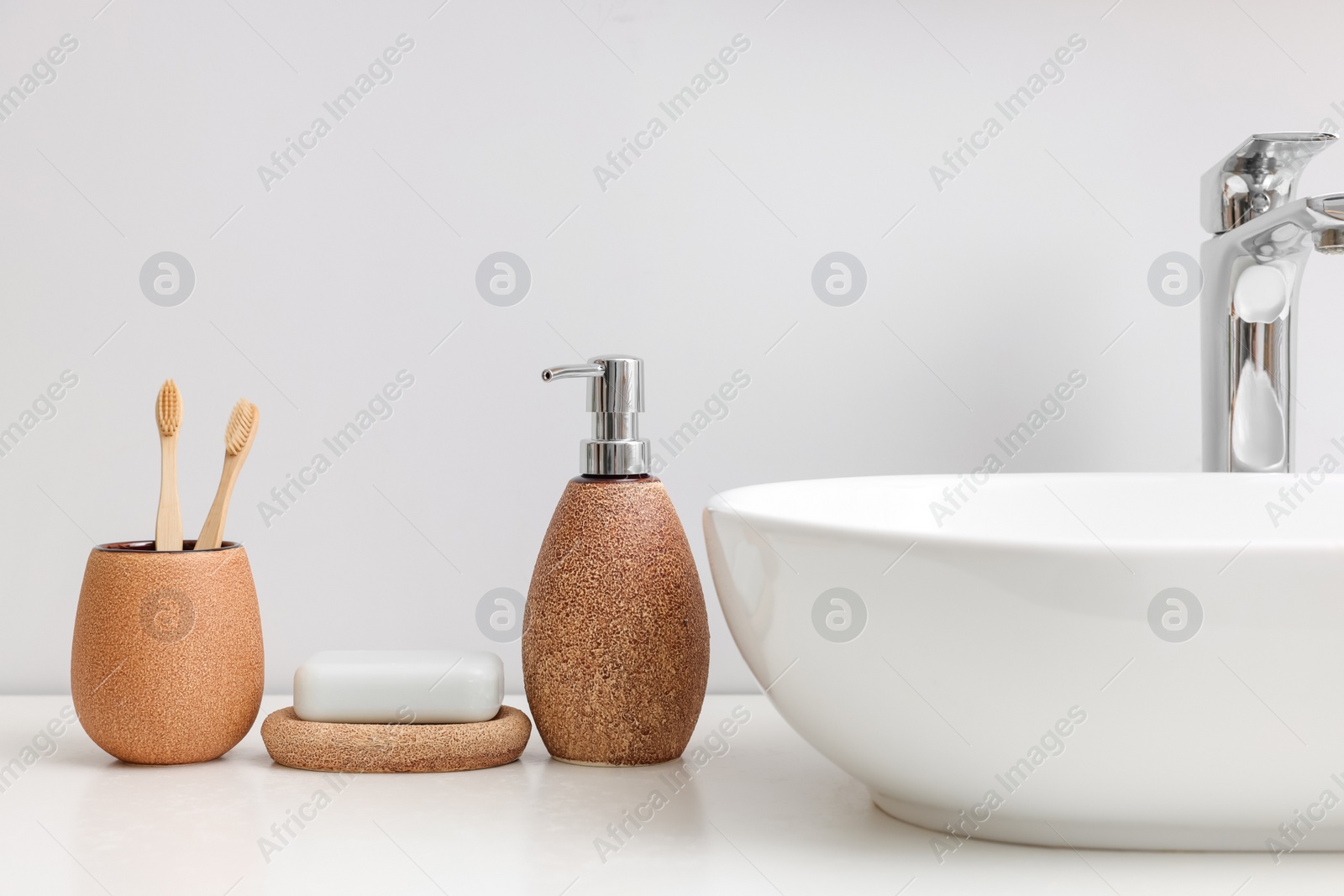 Photo of Set of different bath accessories and products on white table