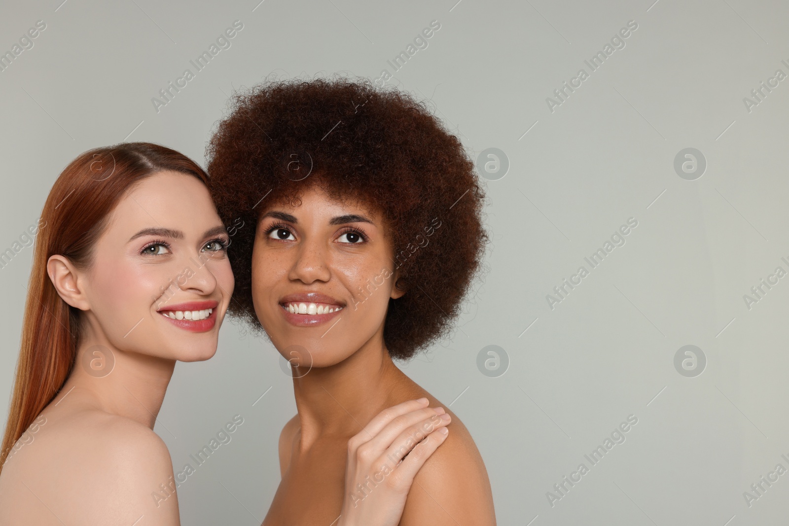 Photo of Portrait of beautiful young women on light grey background. Space for text