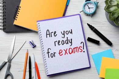 Photo of Notebook with question Are You Ready For Exams? on white wooden table, flat lay