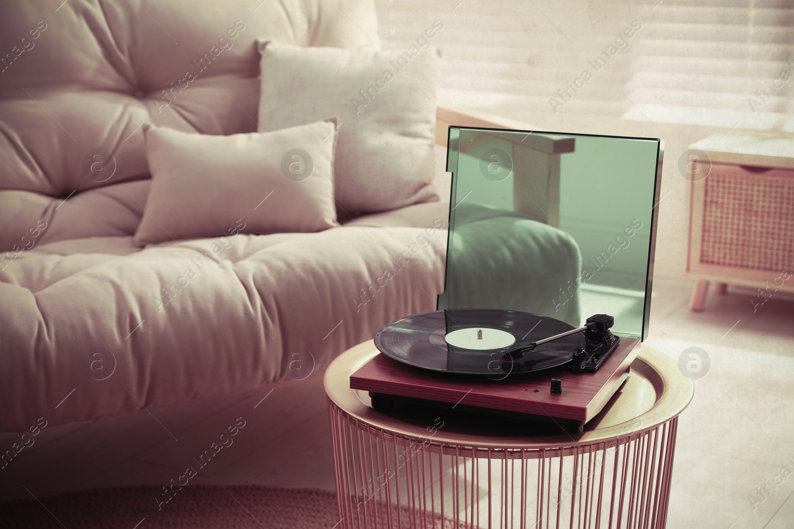 Image of Stylish turntable with vinyl disc in living room