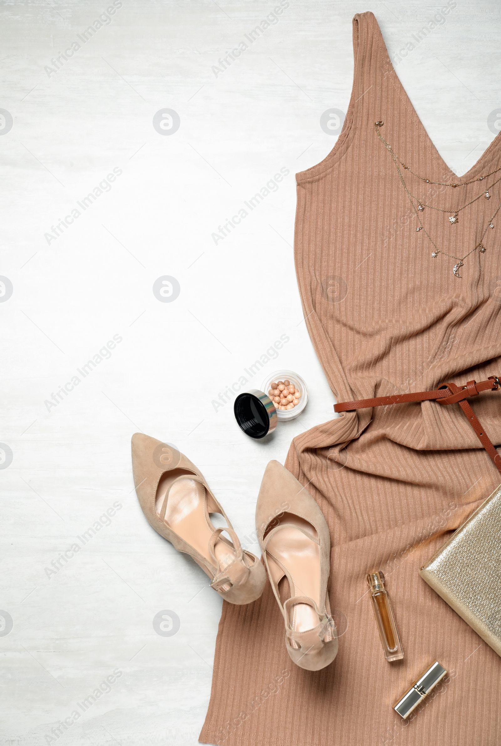 Photo of Flat lay composition with stylish shoes and new dress on white wooden background