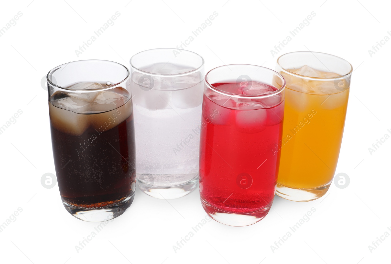 Photo of Glasses of different refreshing soda water with ice cubes on white background