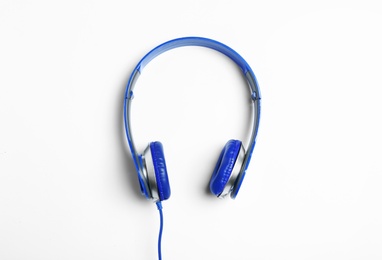 Stylish modern headphones on white background, top view