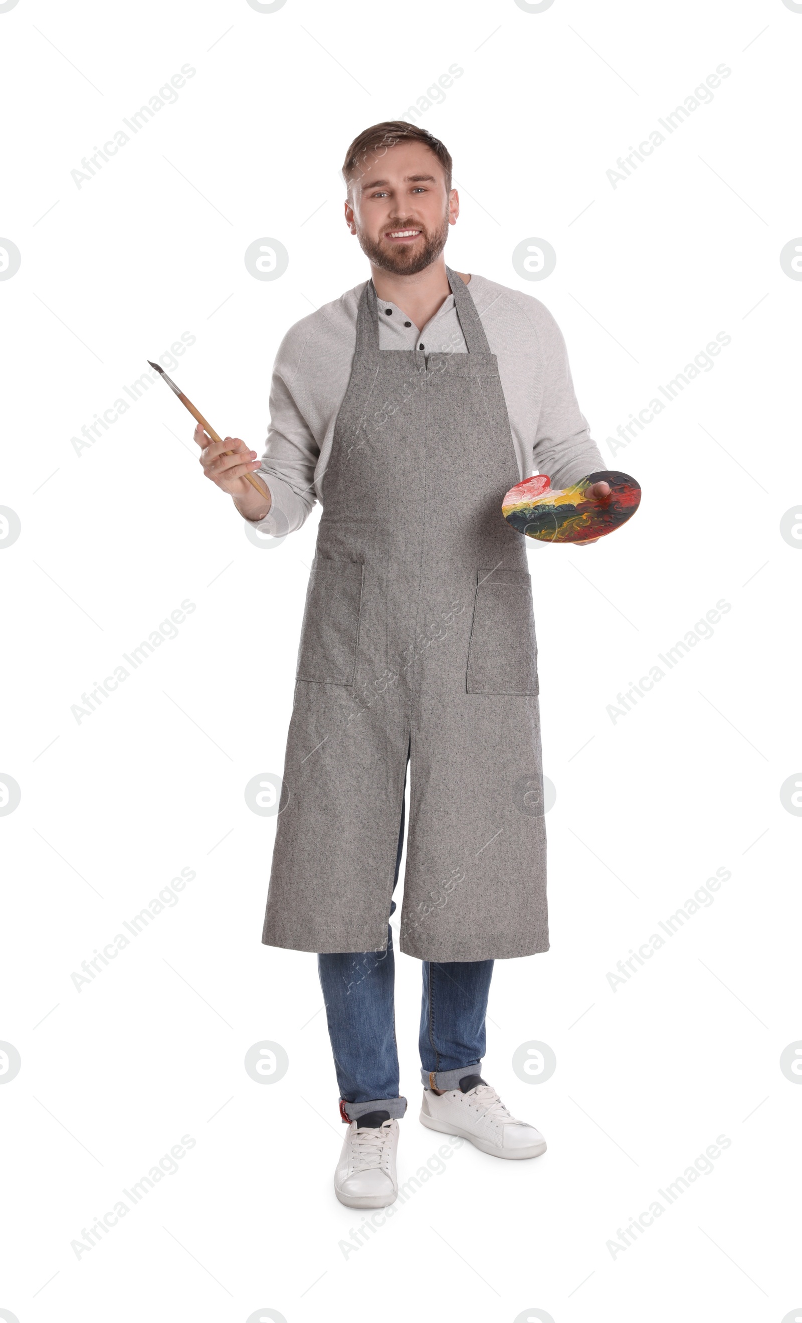 Photo of Man with painting tools on white background. Young artist