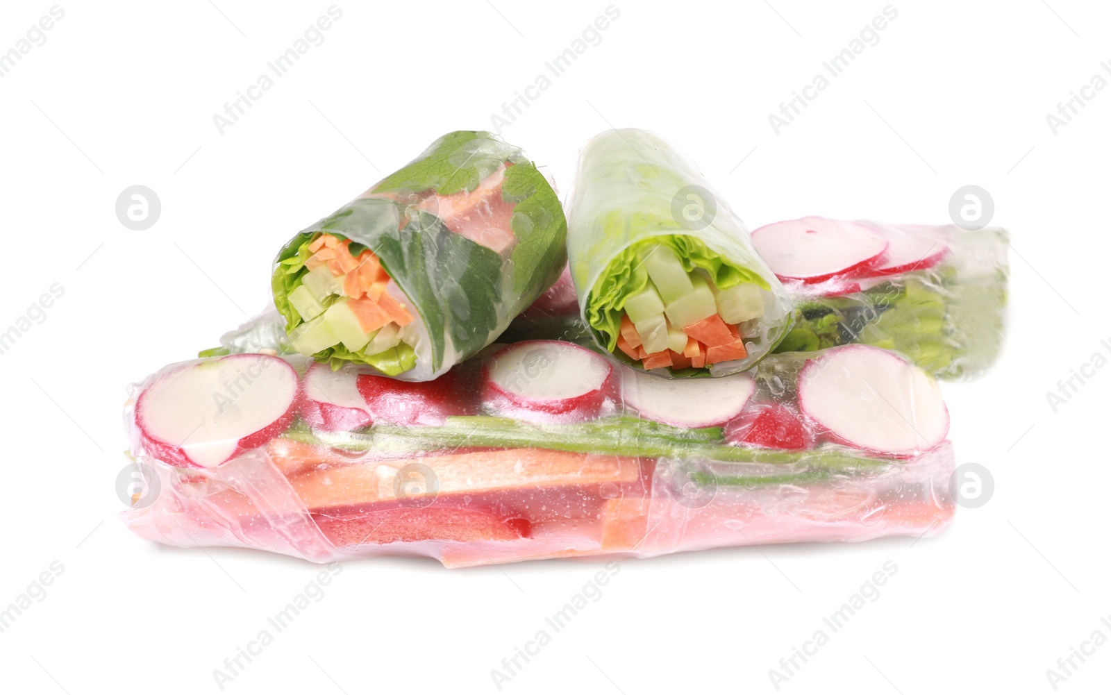 Photo of Different delicious spring rolls wrapped in rice paper on white background