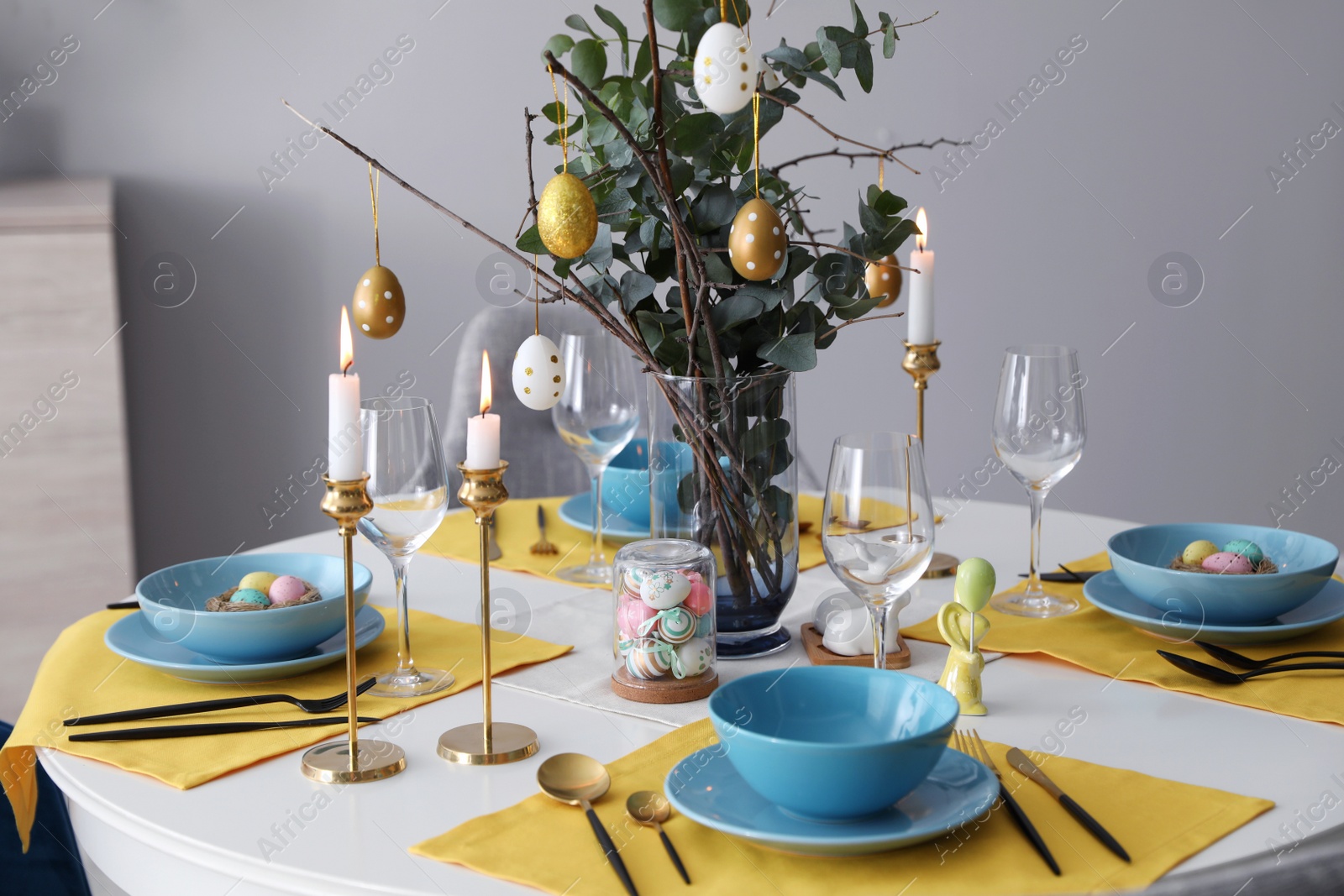 Photo of Beautiful Easter table setting with festive decor indoors