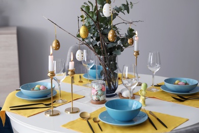 Beautiful Easter table setting with festive decor indoors