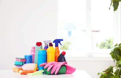 Set of cleaning supplies on table indoors