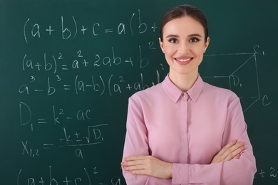 Photo of Portrait of young female teacher in classroom