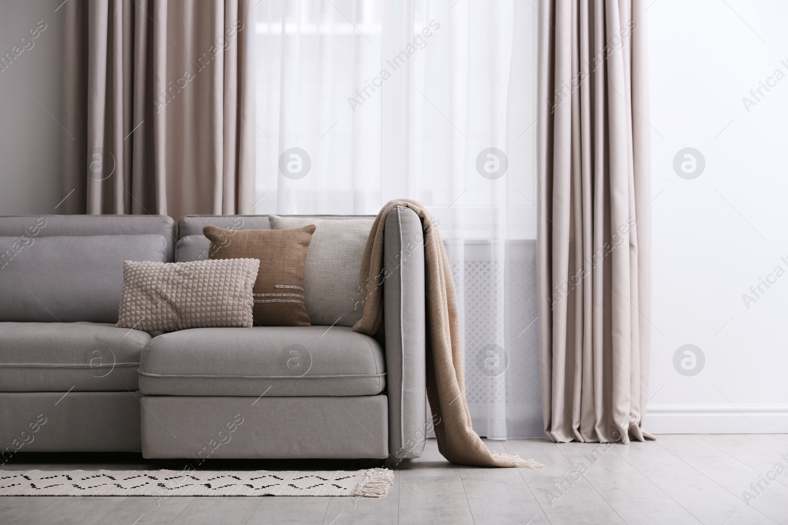 Photo of Modern living room interior with beautiful curtains on window