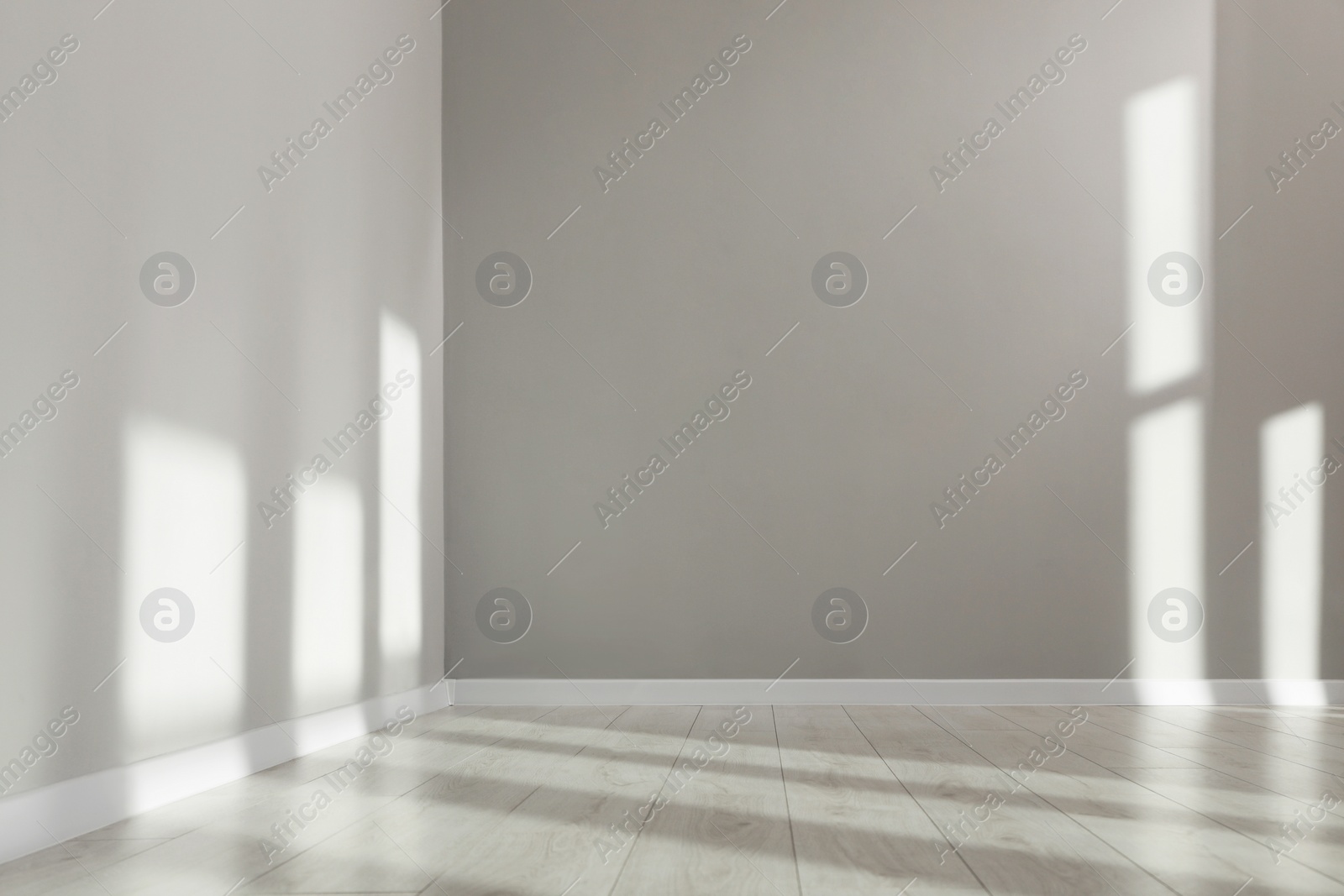 Photo of Light and shadows from window on floor and walls indoors