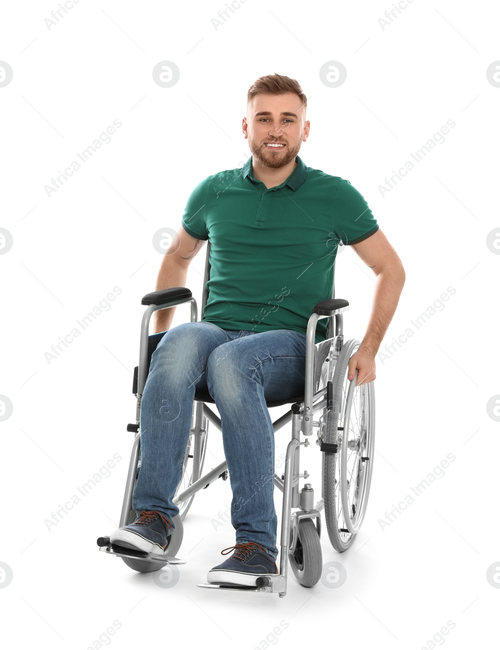 Photo of Handsome young man in wheelchair isolated on white