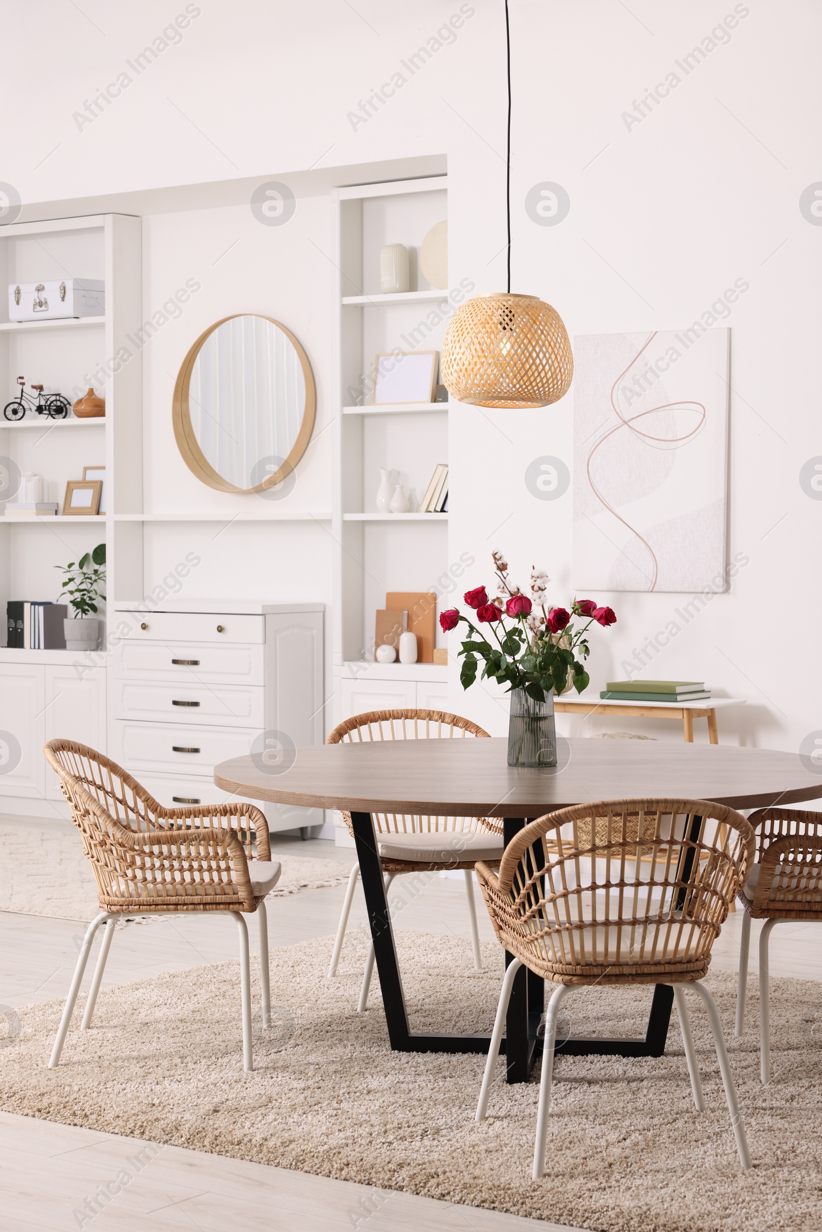 Photo of Stylish dining room interior with table and chairs