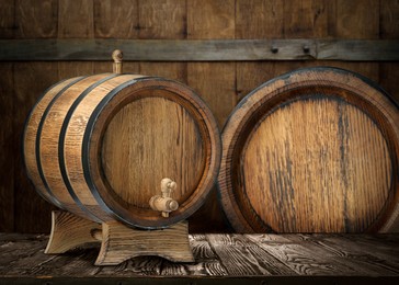 Wooden barrels of different sizes in cellar