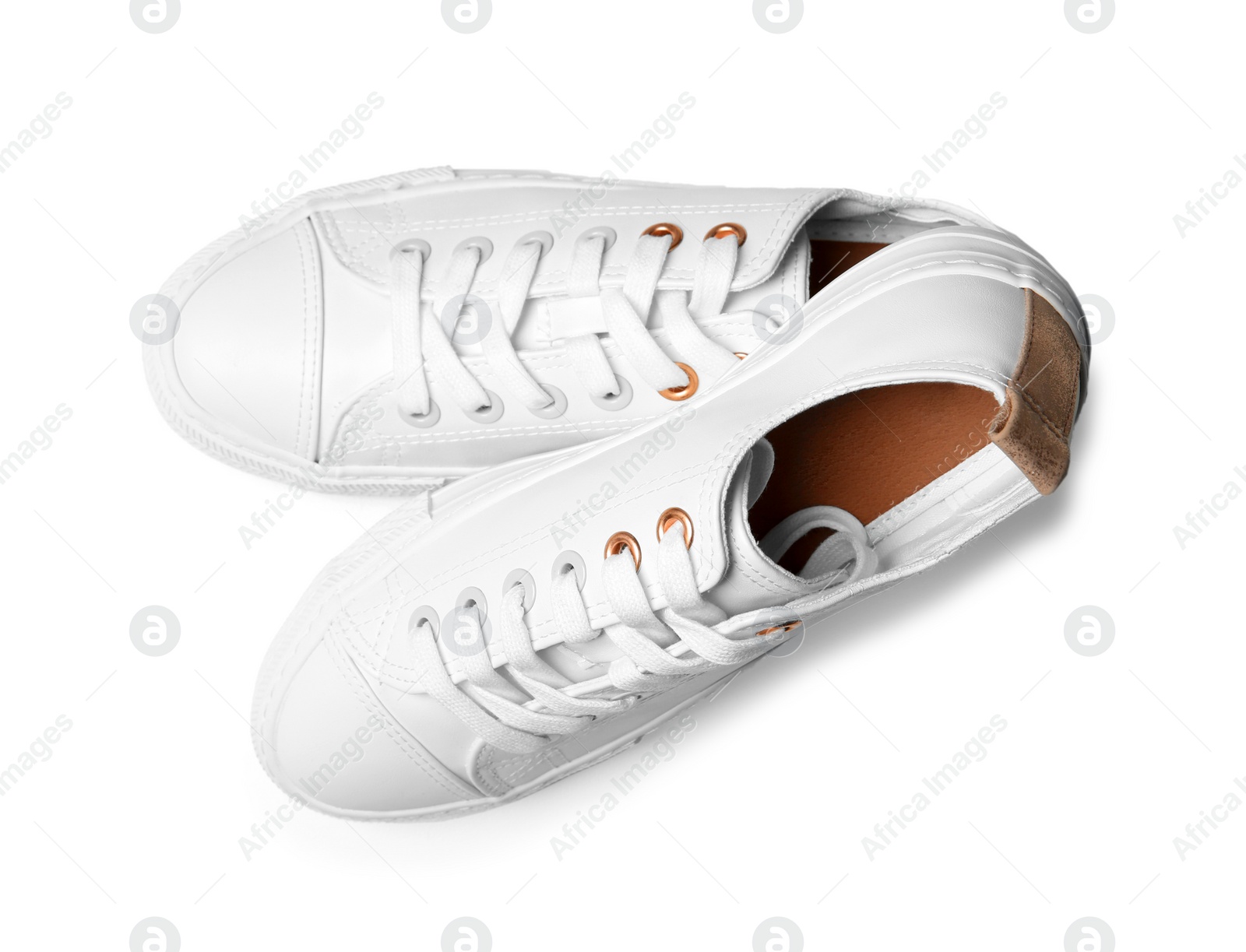 Photo of Pair of casual shoes on white background