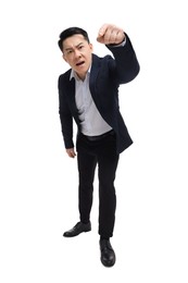 Photo of Angry businessman in suit posing on white background, low angle view