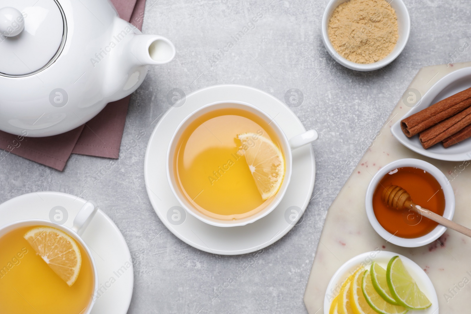 Photo of Flat lay composition with immunity boosting drink on light grey marble table