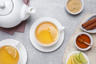 Photo of Flat lay composition with immunity boosting drink on light grey marble table