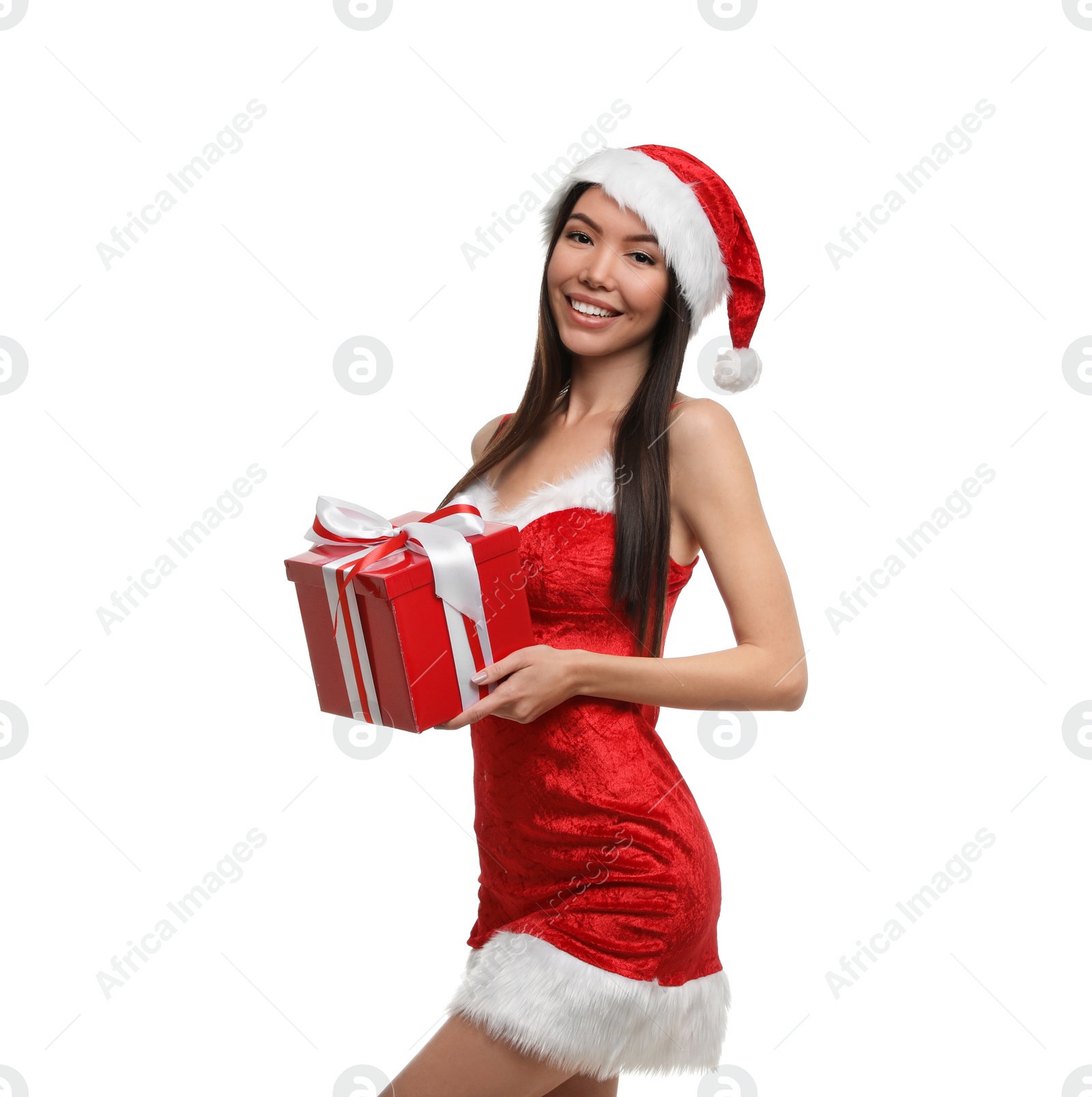 Photo of Beautiful Asian woman in Santa costume with Christmas gift on white background