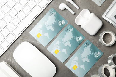 Photo of Flat lay composition with credit cards on grey background